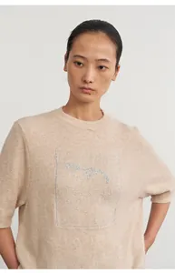 Soft beige knit top with silver jacquard design and comfortable half sleeves