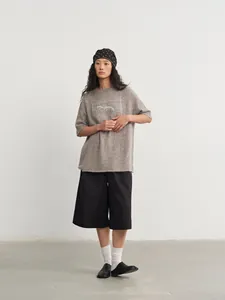Grey loose knitted crew neck top with silver jacquard pattern and half-length sleeves