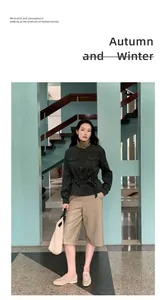 Female model in high-waisted khaki PU leather shorts and dark green utility jacket