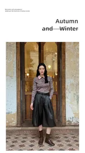 Fashionable high waist black PU leather wide leg culottes styled with a pink knit top