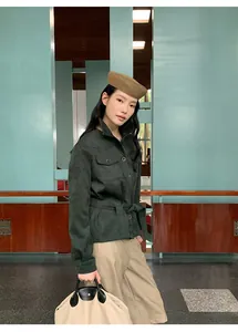 Detailed view of women high waist straight-leg casual pants in khaki color on model