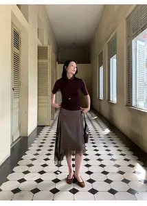 Elegant irregular satin midi skirt with delicate lace stitching for a sophisticated look