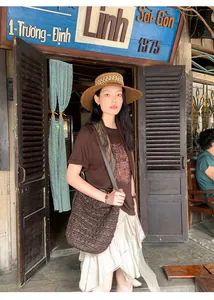 Asymmetrical ruffled skirt with layered texture for a chic early autumn look.