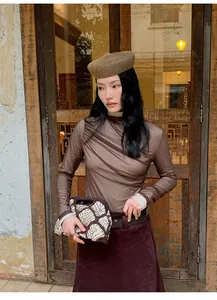 Vintage Maillard style asymmetric A-line skirt shown on a model in a retro setting
