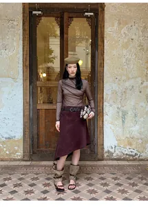 Fashionable burgundy asymmetric A-line midi skirt featuring a retro Maillard style design