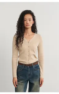 Slim fit beige V-neck soft knitted cardigan for women worn with jeans and brown belt