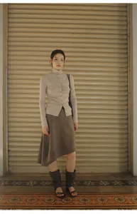 Full view of brown asymmetrical A-line skirt in Maillard retro style fashion
