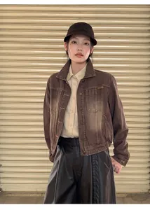 Detail view of a vintage American style gradient washed brown denim jacket for women