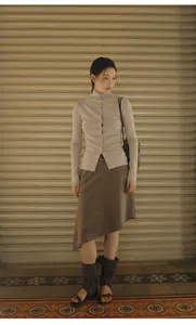 Full length view of vintage Maillard style brown asymmetrical skirt paired with a ribbed top