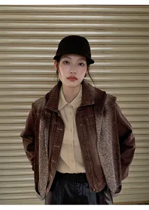 Front view of model wearing an American style gradient washed brown denim short jacket