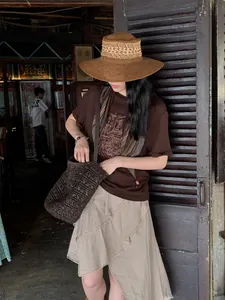 Elegant early autumn asymmetrical midi skirt with textured fabric and ruffles