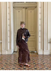 Elegant vintage printed fishtail maxi skirt styled with a retro brown leather jacket and beret