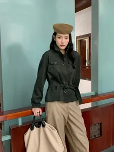 Elegant autumn high-waisted straight casual trousers paired with a dark green suede jacket