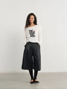 Women's chic high-waisted black PU leather wide-leg culottes for stylish fall outfits.