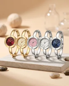 Close-up of elegant Gedi bangle watches featuring Roman numerals and sparkling accents.