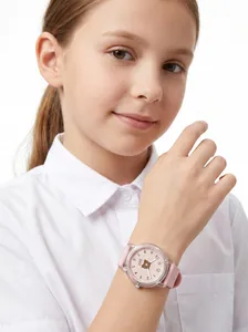 Detail of pink children's quartz watch with cartoon bear dial and soft silicone strap