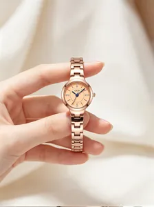 Detailed view of elegant GEDI rose gold stainless steel watch with blue hands and crystals