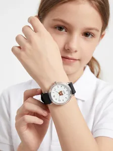 Close-up of girl wearing a Gedi cartoon bear dial watch with a durable black silicone strap.