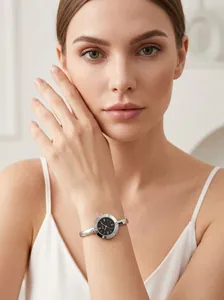 Close-up of Gedi elegant silver bangle watch with black dial and Roman numerals