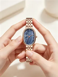 Montre GEDI élégante en or rose avec cadran en nacre bleue et index en cristaux
