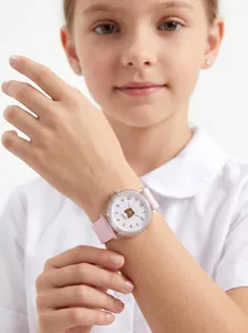 Detailed macro view of pink silicone children's watch with a cute cartoon bear dial