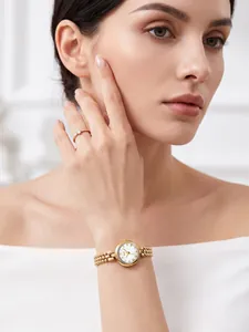 Detail shot of Gedi vintage gold quartz watch with bead chain on model's wrist