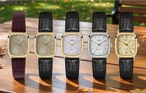 Detailed view of five vintage square women's quartz watches with glitter dials on wood.