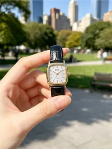 Detailed view of GEDI square quartz watch with black leather strap and glitter dial