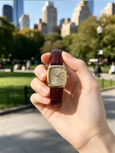 GEDI women's retro square quartz watch with brown leather strap and gold glitter dial.