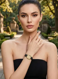 Close-up shot of an elegant GEDI vintage square watch with a gold case and black leather strap