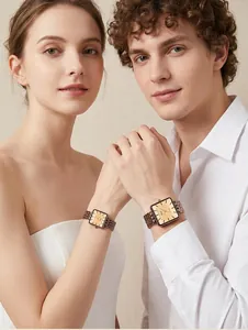 Elegantes relojes de cuarzo Gedi con esfera cuadrada y correa de acero retro usados por pareja.