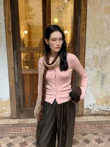 Elegant pink slim fit knitted cardigan for women with a matching soft brown scarf