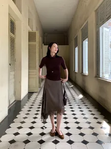 Elegant dark brown irregular satin midi skirt with lace hem for trendy women's autumn wear