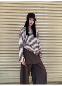 Elegant dark brown high-waisted culottes with layered skirt detail and wide leg.
