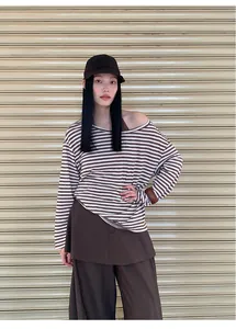Full street style view of a brown striped long-sleeve cover-up and matching brown camisole