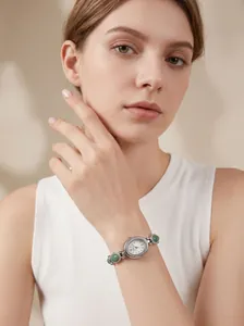 Elegant GEDI women's watch featuring an oval dial and a green jade-style bracelet strap.