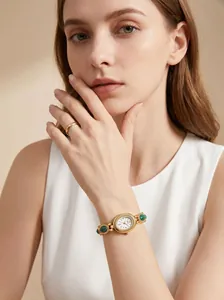 Detail view of GEDI vintage jade bracelet watch with oval diamond dial on a female wrist