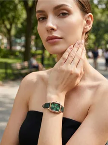 Elegant vintage green dial watch with rose gold case worn by fashion model outdoors