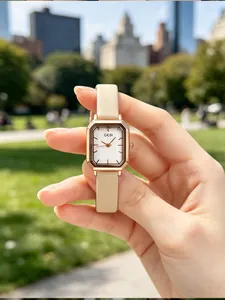 Detailed view of GEDI retro rose gold square quartz watch with elegant beige leather strap