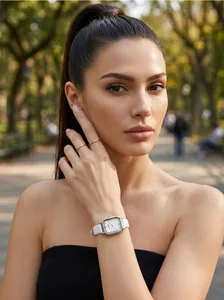 Detail of GEDI vintage square dial watch with white leather strap on female wrist
