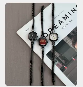 Detail view of vintage square quartz watches with black alloy bracelets in three colors