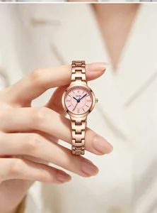 Close-up of elegant GEDI women's quartz watch with pink dial and rose gold steel strap
