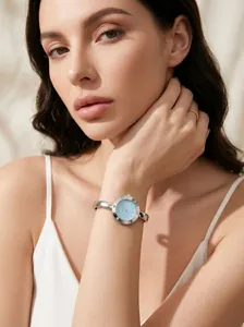 Elegant Guedi silver bangle watch for women with light blue dial and Roman numerals