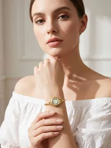 Vintage gold bracelet watch for women with small round dial and Roman numerals