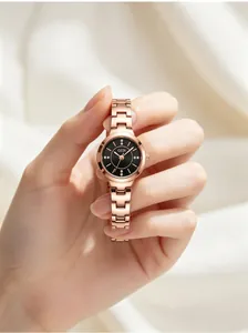 Close-up of elegant GEDI rose gold watch for women featuring a black diamond-set dial.