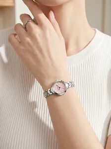 Close-up of GEDI elegant women's quartz watch with pink dial and silver steel strap