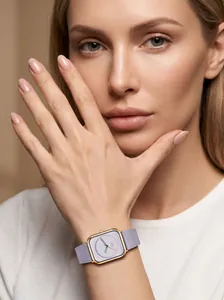 Close-up of elegant women's square watch with purple leather strap and gold case