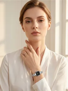 Elegant silver steel band quartz watch for women featuring a black diamond-set dial