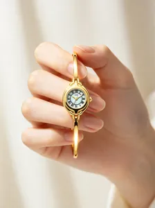 Detailed macro view of GEDI vintage gold small round dial ladies bracelet quartz watch