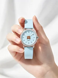 Close-up detail of Gedi light blue kids quartz watch featuring a cute cartoon bear dial